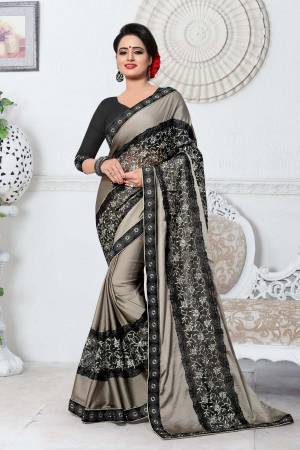 Flaunt Your Rich and Elegant Taste Wearing This Designer Saree In Grey Color Paired With Black Colored Blouse. This Saree Is Fabricated On Silk Paired With Art Silk Fabricated Blouse.  It Is Light Weight And Easy To Care For.