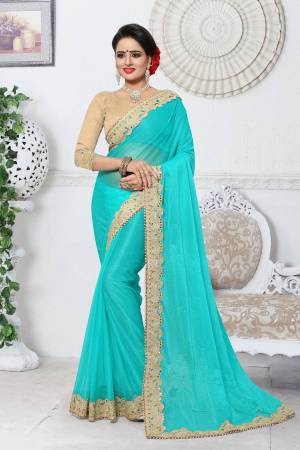 Grab This Lovely Saree In Turquoise Blue Color paired With Beige Colored Blouse. This Saree Is Fabricated On Lycra Paired With Gota Fabricated Blouse. It Is Light In Weight And Easy To Carry All Day Long.