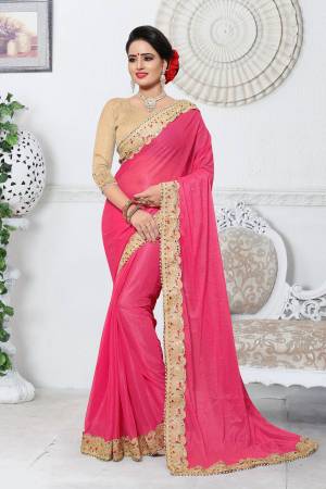 Look Pretty Wearing This Saree In Pink Color Paired With Beige Colored Blouse. This Saree Is Fabricated On Lycra Paired With Gota Fabricated Blouse. It Has Lovely Embroidery All Over The Saree Lace Border. 