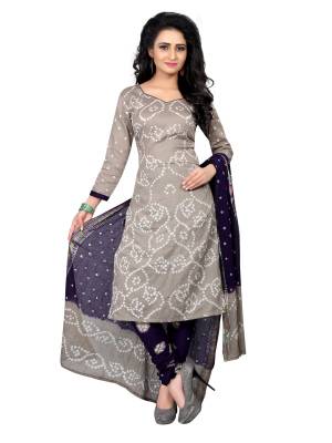 Simple and Elegant Looking Casual Suit Is Here In Grey Colored Top Paired With Contrasting Navy Blue Colored Bottom And Dupatta. This Dress Material Is Fabricated On Satin Cotton Beautified With Bandhani Prints All Over It. Buy This Now And Get This Stitched As Per Your Desired Fit And Comfort.