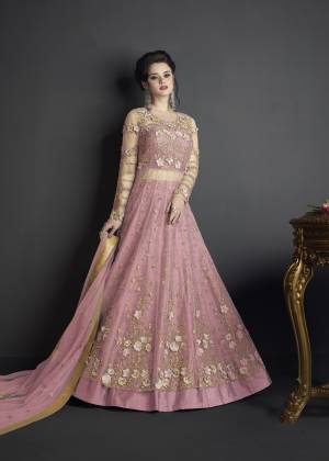 Flaunt Your Rich And Elegant Taste Wearing This Designer Suit In Pink Colored Top Paired With Pink Colored Bottom And Dupatta. Its Top Is Fabricated On Net Paired With Art Silk Fabricated Bottom And Net Fabricated Dupatta. Buy This Suit Now.It Is Beautiful Heavy Embroidery All Over Its Top Making The Suit More Attractive. 