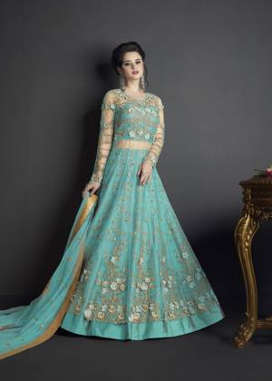 Flaunt Your Rich And Elegant Taste Wearing This Designer Suit In Turquoise Blue Colored Top Paired With Turquoise Blue Colored Bottom And Dupatta. Its Top Is Fabricated On Net Paired With Art Silk Fabricated Bottom And Net Fabricated Dupatta. Buy This Suit Now.It Is Beautiful Heavy Embroidery All Over Its Top Making The Suit More Attractive. 
