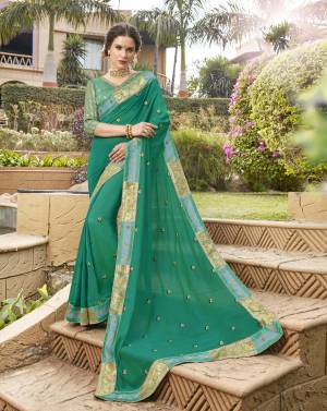 Here Is A Very Pretty Saree In Sea Green Color Paired With Sea Green Colored Blouse. This Saree Is Fabricated On Silk Georgette Paired With Jacquard Silk Fabricated Blouse. This Simple And Elegant Looking Saree Is Suitable For All Occasion Wear.