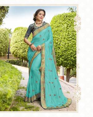 Beautiful Shade In Blue Is Here With This Designer Saree In Turquoise Blue Color Paired With Navy Blue Colored Blouse. This Saree Is Fabricated On Silk Georgette Paired With Jacquard Silk Fabricated Blouse. Buy This Designer Saree Now.