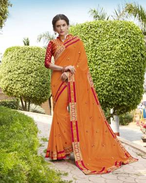 Orange Color Induces Perfect Summery Appeal To Any Outfit, So grab This Designer Saree In Orange Color Paired With Contrasting Red Colored Blouse. This Saree Is Fabricated On Silk Georgette Paired With Jacquard Silk Fabricated Blouse. It Is Light Weight And Ensures Superb Comfort all Day Long.