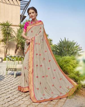 Flaunt Your Rich And Elegant Taste Wearing This Designer Saree In Grey Color Paired With Rani Pink Colored Blouse. This Saree And Blouse Are Fabricated On Art Silk Beautified With Embroidered Motifs And Lace Border. Buy Now.