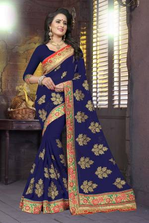 Enhance Your Personality Wearing This Beautiful Designer Saree In Navy Blue Color Paired With Navy Blue Colored Blouse. This Saree And Blouse Are Fabricated On Georgette Beautified With Heavy Embroidery. This Saree Is Light Weight And Easy To Carry All Day Long.