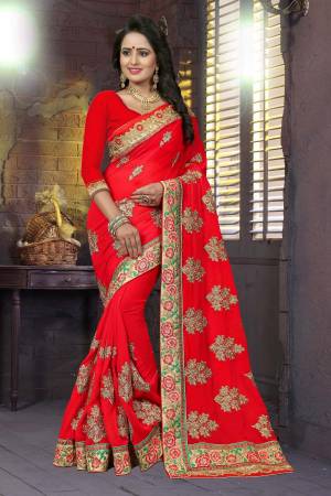Adorn The Angelic Look wearing This Heavy Designer Saree In Red Color Paired With Red Colored Blouse. This Saree And Blouse Are Fabricated On Georgette Beautified With Heavy Work. It Also Ensures Comfort Throughout The Gala.