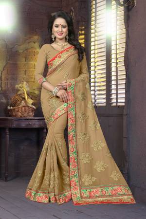 Flaunt Your Rich And Elegant Taste Wearing This Designer Saree In Beige Color Paired With Beige Colored Blouse. This Saree And Blouse Are Fabricated On Georgette Beautified With Jari And Thread Embroidery. Buy Now.