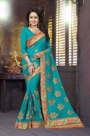 Shades In Blue Always Gives A Fresh And Pretty Look To Your Personality, Grab This Designer Saree In Turquoise Blue Color Paired With Turquoise Blue Colored Blouse. This Saree And Blouse Are Fabricated On Georgette Beautified With Heavy Embroidery.