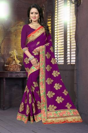 Attract All With This Bright Colored Saree In Dark Purple Paired With Dark Purple Colored Blouse. This Saree And Blouse are Fabricated On Georgette Beautified With Heavy Embroidery All Over Making The Saree More Attractive. Buy This Saree Now.