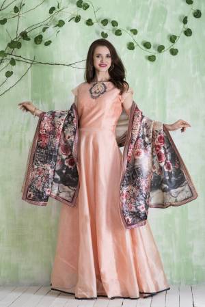 Look Pretty wearing This Lovely Shade In Peach Colored Designer Floor Length Top Paired With Peach Colored Bottom And Multi Colored Dupatta. Its Top Is Fabricated On Chanderi Paired With Lycra Leggings And Digital Printed Silk Dupatta. All Its Fabric And Lovely Color Will Give You A Rich Look Like Never Before.