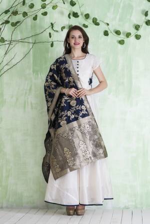 Simple and Elegant Looking Designer Floor Length Suit Is Here In White Colored Top Paired With White Colored Leggings And Navy Blue Colored Dupatta. Its Top Is Fabricated On Chanderi Paired With Lycra Leggings And Silk Jacquard Dupatta. This Pretty Readymade Suit Is Light Weight And easy To Carry All Day Long.