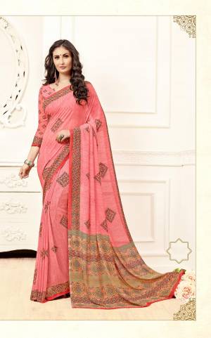 Look Pretty wearing This Printed Saree In Pink Color Paired With Pink Colored Blouse. This Saree And Blouse are Fabricated On Georgette Beautified With Prints All Over It.