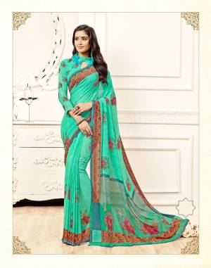 For Your Semi-Casual Wear, Grab This Pretty Saree In Sea Green Color Paired With Sea Green Colored Blouse. This Saree And Blouse are Fabricated On Georgette Beautified With Prints All Over It. Buy Now.