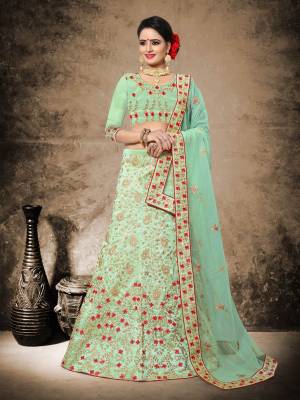 This Season Is About Subtle Shades And Pastel Play In Ethnic Wear, Grab This Heavy Deisgner Lehenga Choli In Pastel Green Color Paired With Pastel Green Colored Dupatta. Its Blouse and Lehenga Are Fabricated On Art Silk Paired With Net Fabricated Dupatta. It HAs Heavy Contrasting Embroidery All Over It.