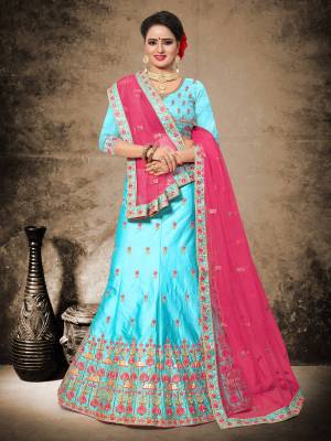 Here Is An Attractive Combination With This Designer Heavy Lehenga Choli In Turquoise Blue Color Paired With Contrasting Rani Pink Colored Dupatta. Its Blouse And Lehenga Are Fabricated On Velvet Satin Paired With Net Fabricated Dupatta. Its Fabric Ensures Superb Comfort All Day Long.