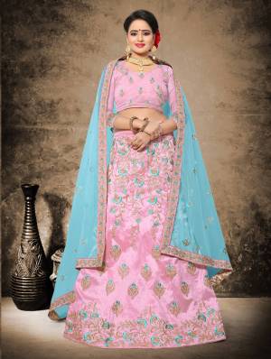 If Your Are Fond Of Light Shades Than Grab This Heavy Designer Lehenga Choli In Light Pink Color Paired with Contrasting Aqua Blue Colored Dupatta. Its Blouse And Lehenga Are Fabricated On Art Silk Paired With Net Fabricated Dupatta. This Lehenga Choli Will Give A Very Pretty Look To Your Personality. Buy Now.