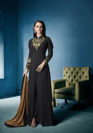 Here Is  Designer Readymade Suit In Black Color Paired With Black Colored Bottom And Beige Colored Dupatta. Its Top Is Fabricated On Georgette Paired With Santoon Bottom And Chiffon Dupatta. Its Pretty Pattern And Embroidery Will Earn You Lots Of Compliments From Onlookers.