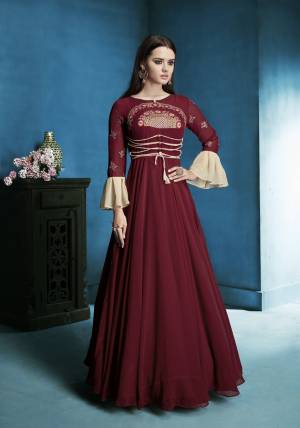 Adorn the Royal Look, Wearing this Designer Floor Length Readymade Suit In Maroon Color Paired With Maroon Colored Bottom And dupatta. Its Top Is Fabricated On Georgette Paired With Santoon Bottom And Chiffon Dupatta. It Has Bell Sleeve Pattern Which Will Give A Diffrent Look.