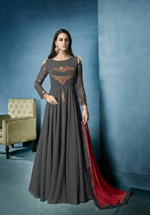 Flaunt Your Rich And Elegant Taste Wearing This Designer Floor Length Suit In Grey Colored Top Paired With Grey Colored Bottom And Contrasting Red Colored Dupatta. Its Is Light Weight And Easy To Carry Throughout The Gala.