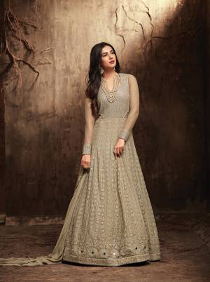 Rich And Elegant Looking, Designer Floor Length Suit Is Here In Grey Color. This Heavy Designer Suit Is Fabricated Georgette Paired With Santoon bottom and Chiffon Dupatta. It Has Heavy Embroidery All Over It Top Making The Suit Attractive.