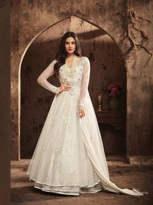 Simple And Elegant Looking Designer Floor Length Suit Is Here In White Colored Top Paired With White Colored Bottom And Dupatta. Its Top Is Fabricated On Net Paired With Santoon Bottom And Chiffon Dupatta. This Pretty Suit Will Give You Fairy Look Like Never Before.