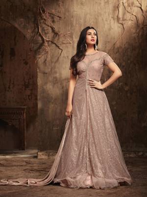 New And Unique Shade In Purple Is Here To Add Into Wardrobe, Grab This Beautiful Designer Suit In Mauve Color Fabricated On Net With Satin Inner Paired Mauve Colored Net Fabricated dupatta. This Lovely Color Will Earn You Lots Of Compliments From Onlookers.