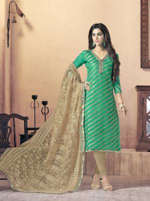 Simple Suit Is Here For Your Casual Wear In Green Colored Top Paired With Beige Colored Bottom And Dupatta. Its Top Is Fabricated On Silk Jacquard Paired With Cotton Bottom And Net Dupatta. Buy This Dress Material And Get This Stitched As Per Your Desired Fit And Comfort.