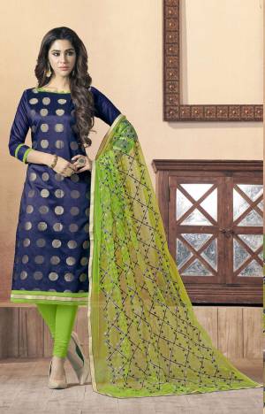 Enhnace You Personality With This Suit In Bold Navy Blue Colored Top Paired With Contrasting Green Colored Bottom And Dupatta. Its Top Is Fabricated On Silk Jacquard Paired With Cotton Bottom And Net Dupatta.  Buy Now.