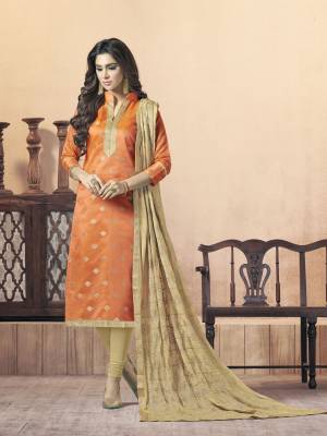 For Your Festive Or Formal Wear, Grab This Dress Material In Orange Colored Top Paired With Beige Colored Bottom And Dupatta. Its Top Is Fabricated On Silk Jacquard Paired With Cotton Bottom And Chiffon Dupatta. It Is Light In Weight And Easy To Carry All Day Long.