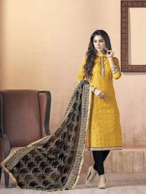 You Will Definitely Earn Lots Of Compliments Wearing This Straight Cut Suit In Yellow Colored Top Paired With Black Colored Bottom And Dupatta. Its Top Is Fabricated On Silk Jacquard Paired With Cotton Bottom And Net Dupatta. Get This Stitched As Per Your Desired Fit And Comfort.
