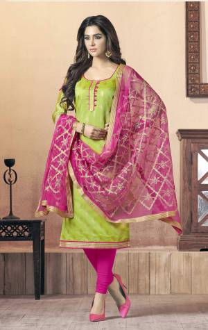 Shine Bright Wearing This Designer Straight Dress Material In Green Colored Top Paired With Contrasting Rani Pink Colored Bottom And Dupatta. Its Top Is Fabricated On Silk Jacquard Paired With Cotton Bottom And Net Dupatta. Buy Now.