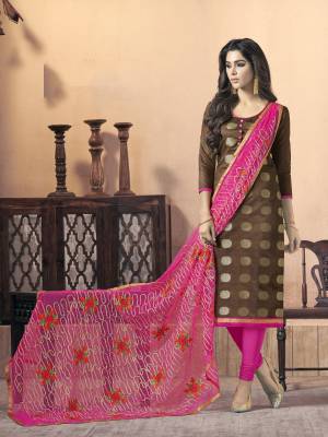 Look Beautiful Wearing This Straight Suit In Brown Colored Top Paired With Contrasting Pink Colored Bottom And Dupatta. Its Top Is Fabricated On Silk Jacquard Paired With Cotton Bottom And Net Dupatta. Its Lovely Color Pallete Will Give A Pretty Look Like Never Before.