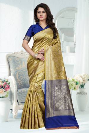 Add This New Shade In Green To Your Wardrobe With This Silk Saree In Pear Green Color Paired With Contrasting Royal Blue Colored Blouse. This Saree Is Fabricated On Banarasi Art Silk Paired With Art Silk Fabricated Blouse. It Easy Drape And Easy To Care For.