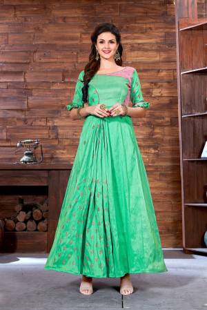 Celebrate This Festive Season Wearing This Designer Floor Length Readymade Gown In Light Green Color Fabricated On Art Silk. This Gown Is Beautified With Jari Work With A Lovely Two Colored Pattern. 