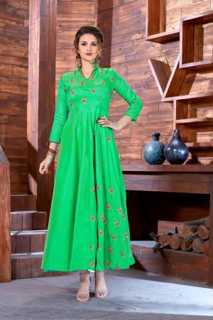 Simple And Elegant Looking Designer Readymade Gown Is Here In Green Color Fabricated On Art Silk Beautified With Jari And Thread Small Floral Motifs. 
