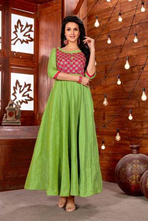 Celebrate This Festive Season Wearing This Designer Readymade Gown In Green Color Fabricated On Art Silk. It Has Lovely Embroidered Yoke In Pink Color. Buy This Readymade Gown Now.