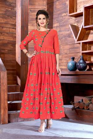 Look Attractive Wearing This Designer Floor Length Gown In Orange Color Fabricated On Art Silk. This Pretty Gown Ensures Superb Comfort Throughout The Gala.