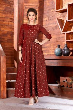 Flaunt Your Rich And Elegant Taste Wearing This Designer Floor Length Readymade Gown In Brown Color Fabricated On Art Silk Beautified With Jari Embroidered Small Motifs All Over It. This Simple And Elegant Looking Dress Will Earn You Lots Of Compliments From Onlookers.