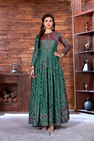 New And Unique Shade Is Here With This Designer Floor Length Gown In Teal Green Color Fabricated On Art Silk. Its Fabric Ensures Superb Comfort Throughout The Gala. Buy Now.