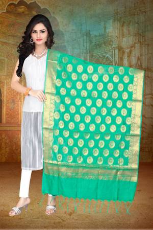 Add This Lovely Sea Green Colored Dupatta Fabricated On Banarasi Art Silk Beautified With Weave All Over. You Can Pair This Up With Any contrasting Colored Suit. 
