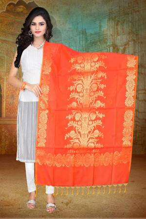 Shine Bright With This Beautiful And Attractive Dupatta In Orange Color Fabricated On Banarasi Art Silk Beautified With Weave. This Can Be Paired With Any Contrasting Colored Kurti Or Suit. Buy Now.
