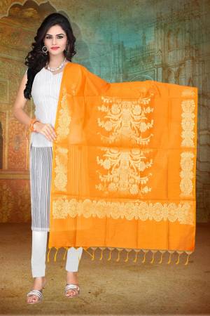 Celebrate This Festive Season Pairing Your Simple Dress With This Attractive Musturd Yellow Colored Dupatta. This Dupatta IS Fabricated On Banarasi Art Silk Beautified With Weave. 