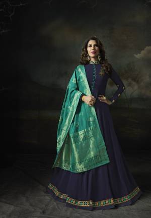 Enhance Your Perosnality Wearing This Designer Floor Length Suit In Navy Blue Color Paired With Navy Blue Colored Bottom And Blue Colored Dupatta. Its Top Is Fabricated On Georgette Paired With Santoon Bottom And Banarasi Art Silk Dupatta. 