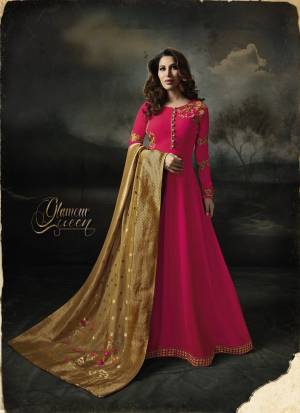 Shine Bright Wearing This Designer Floor Length Suit In Dark Pink Color Paired With Dark Pink Colored Bottom And Beige Colored Dupatta. Its Top IS Fabricated On Georgette Paired With Santoon Bottom And Banarasi Art Silk  Dupatta. Buy This Semi-Sttched Suit Now.
