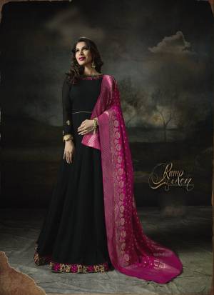 For A Bold And Beautiful Look, Grab This Designer Floor Length Suit In Black Color Paired With Black Colored Bottom And Magenta Pink Colored Dupatta. Its Top Is Fabricated On Georgette Paired With Santoon Bottom And Banarasi Art Silk Dupatta. It Has Attractive Embroidery Over The Top. Buy Now.