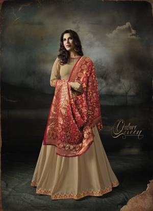 Simple, Elegant And Evergreen Color Pallete In Ethnic Wear Is Here with This Designer Floor Length Suit In Beige Color Paired With beige Colored Bottom And Red Colored Dupatta. Its Top Is Fabricated On Georgette Paired With Santoon Bottom And Banarasi Art Silk Dupatta. Buy This Designer Suit Now.