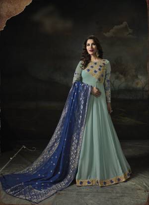 Look Pretty In This Lovely Color Pallet In Shades Of Blue. This designer Floor Length Top Is In Aqua Blue Color Paired With Aqua Blue Colored Bottom And Blue Colored Dupatta. Its Top Is Fabricated On Georgette Paired With Santoon Bottom And Banarasi Art Silk Dupatta. Buy This Semi-Stitched Suit Now.