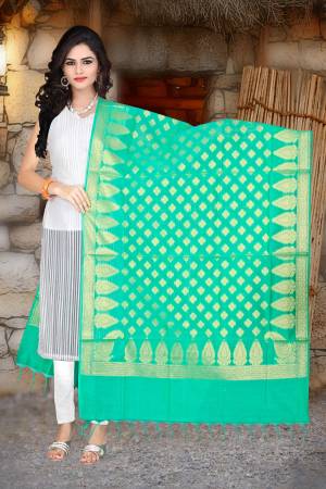 Add This Lovely Sea Green Colored Dupatta Fabricated On Banarasi Art Silk Beautified With Weave All Over. You Can Pair This Up With Any contrasting Colored Suit. 